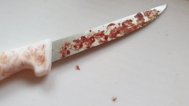 istock Bloodstained knife on white background 1157766456