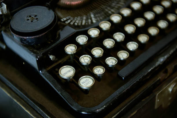 istock Ancient typewriters placed on old wooden tables 1157767233