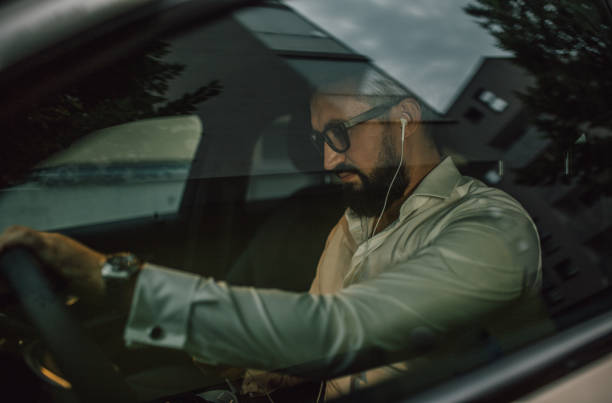istock Businessman sits in his vehicle 1157767299