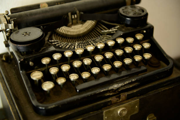 istock Ancient typewriters placed on old wooden tables 1157767312