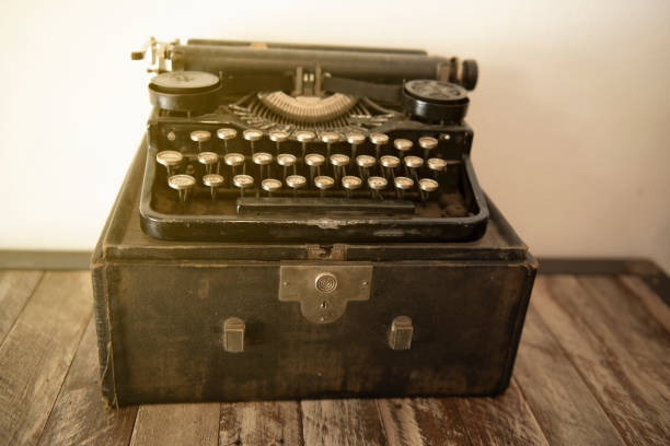 istock Ancient typewriters placed on old wooden tables 1157767319