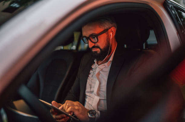 istock Businessman sits in his vehicle 1157767370
