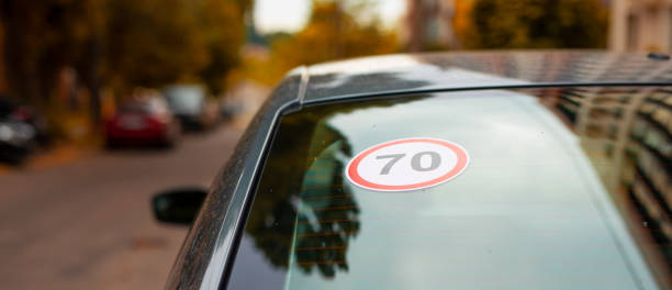 Speed limit sign 70 kmph on the back window of car