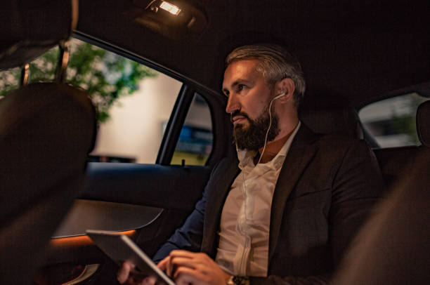 istock Businessman sits in his vehicle 1157768595