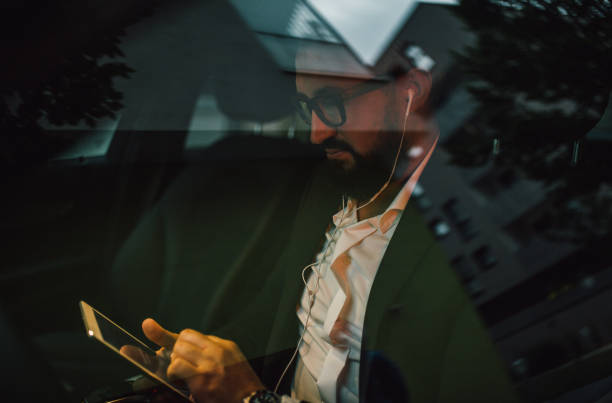 istock Businessman sits in his vehicle 1157769350
