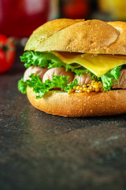 istock burger with sausages, cf, lettuce, tomato sauce (snack sandwich, kaiser bun). top food background. copy space 1157769430