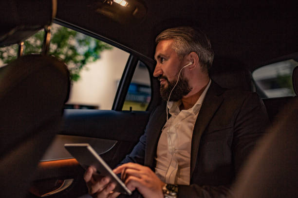istock Businessman sits in his vehicle 1157769678