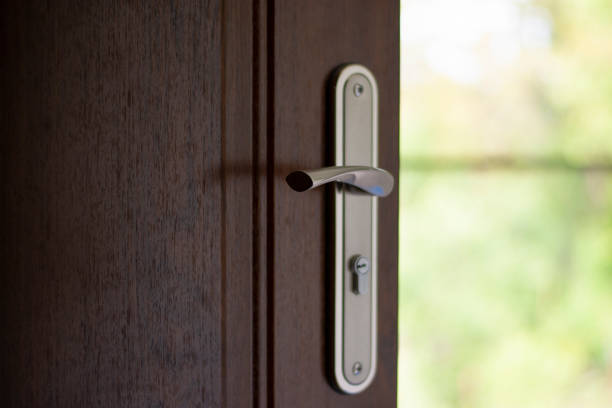 istock Modern wooden door and key lock 1157772345