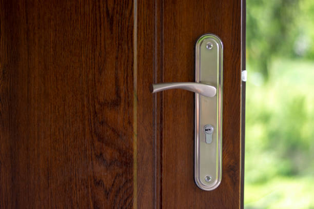 istock Modern wooden door and key lock 1157772446