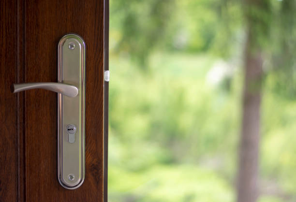 istock Modern wooden door and key lock 1157772571