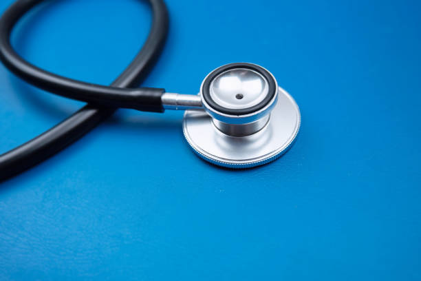 istock Closeup head of Stethoscope on background,blurry light around 1157773691