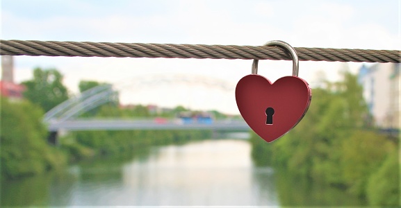 a love lock hanged on the bridge to save the date in germany. It was such a beautiful townto save the sates.