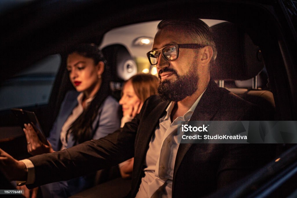 Parents go home with their daughter Parents drive home with their daughter Adult Stock Photo