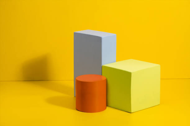 istock Geometric shapes in different colors on yellow background. 1157778553