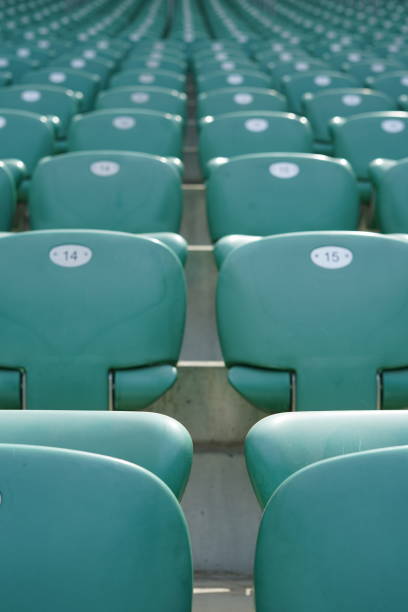 istock Green rows of chairs at stadium 1157779196