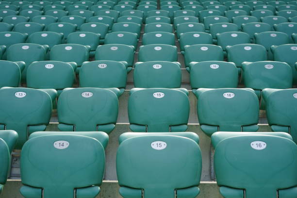 istock Green rows of chairs at stadium 1157779259