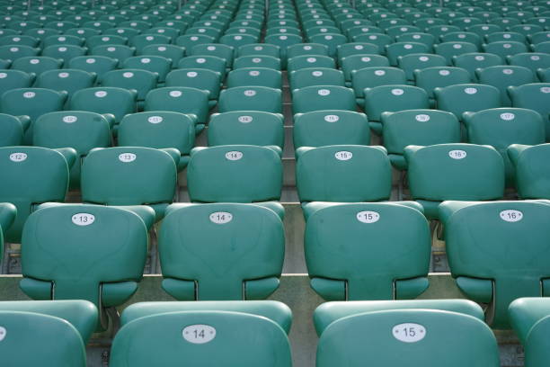 istock Green rows of chairs at stadium 1157779264
