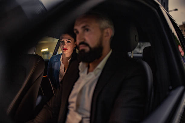 istock Businesswoman is driven by your chauffeur 1157779308