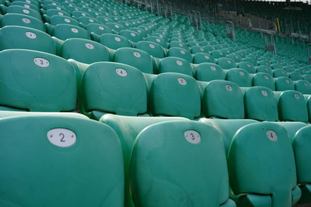 istock Green rows of chairs at stadium 1157779322