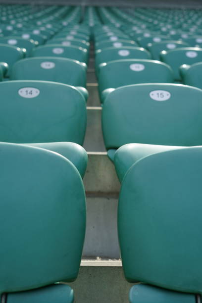 istock Green rows of chairs at stadium 1157779332