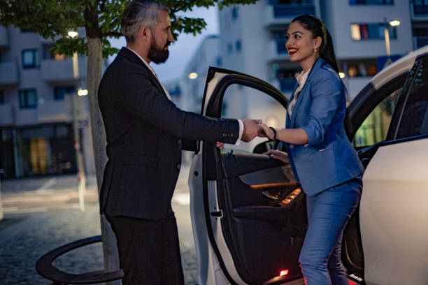 istock Businesswoman is driven by your chauffeur 1157779431