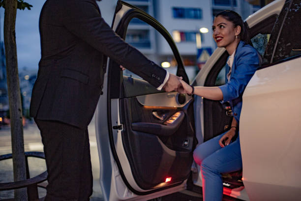 istock Businesswoman is driven by your chauffeur 1157779769