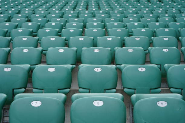 istock Green rows of chairs at stadium 1157780549