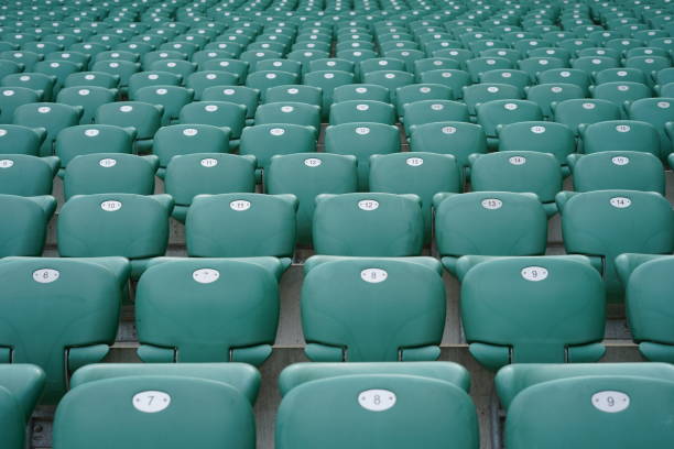 istock Green rows of chairs at stadium 1157781175