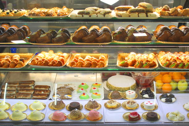 istock Various dessert sweets and cakes in shop window or in cafe 1157781391