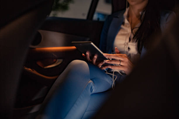 istock Businesswoman is driven by your chauffeur 1157781482