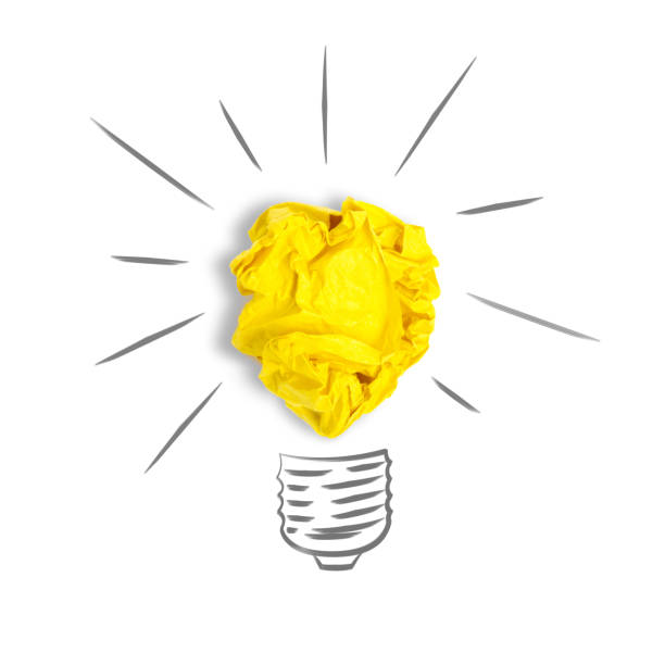 istock Idea with crumpled yellow orange paper ball, lightbulb 1157783453