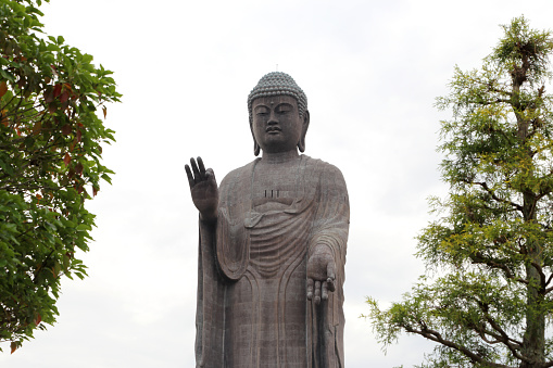 Ushiku, Japan - May 28, 2019: The Great Buddha Ushiku Daibutsu statue is loacated Ibaraki Prefecture, Japan.