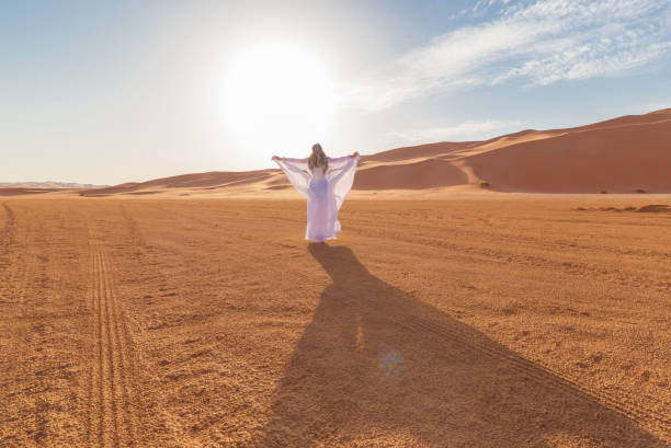 istock UAE. Woman in desert 1157786142