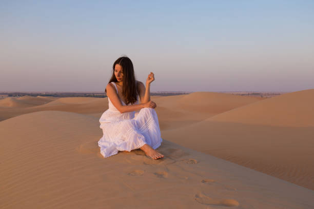 istock UAE. Woman in desert 1157786148