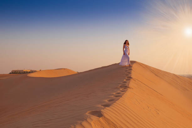 istock UAE. Woman in desert 1157786162