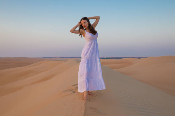 istock UAE. Woman in desert 1157786227