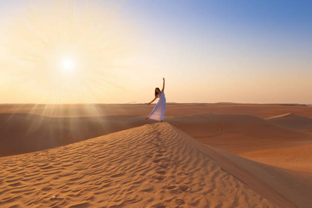 istock UAE. Woman in desert 1157786279