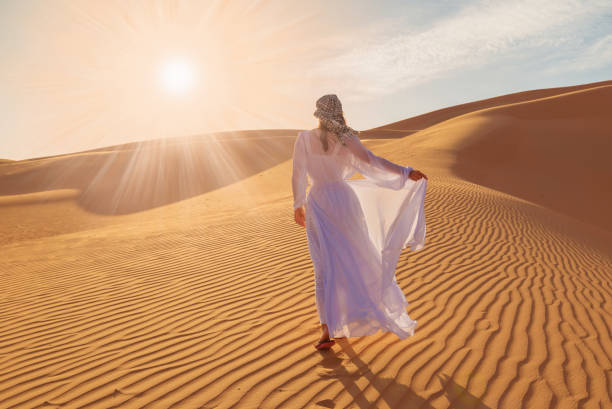 istock UAE. Woman in desert 1157786316