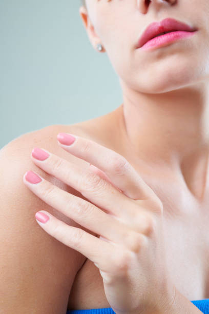 istock Woman applying body lotion 1157787387