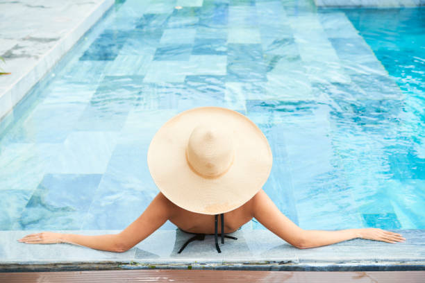 istock Woman at luxurious resort 1157789180