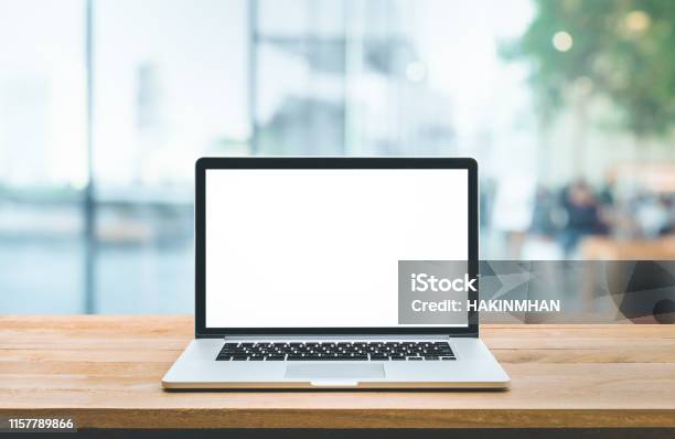 Modern Computerlaptop With Blank Screen On Counter Barand Window View Stock Photo - Download Image Now