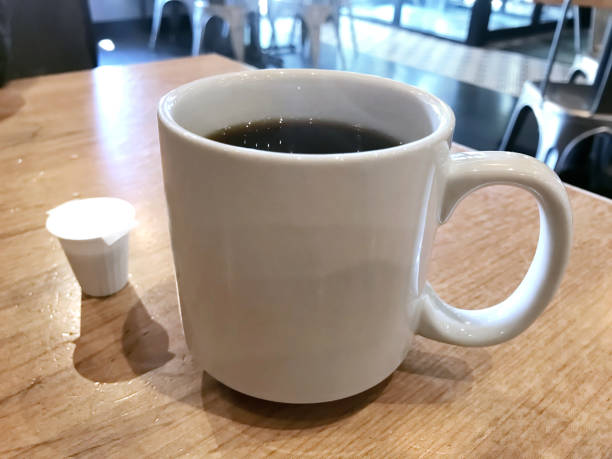 istock Cup of coffee in a diner table 1157789908