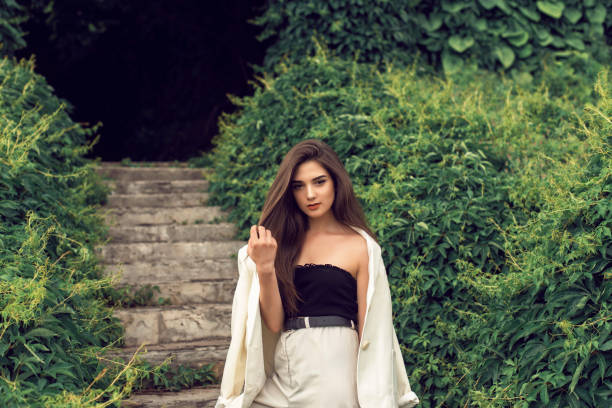 Young brunette in stylish modern clothes