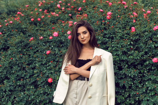 Young brunette in stylish modern clothes