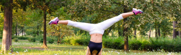 istock Young woman exercising in the nature 1157795303