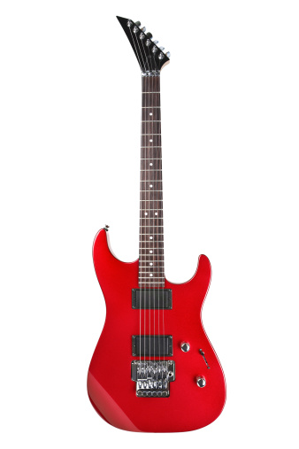 Extreme Close up shot of a red electric guitar