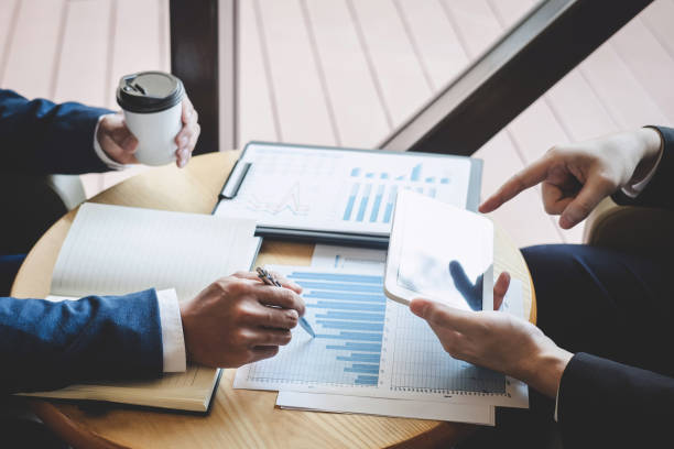 istock Business people team discuss and analyzing on meeting to planning investment project working and presentation strategy of business making conversation with partner, financial and accounting concept 1157798297
