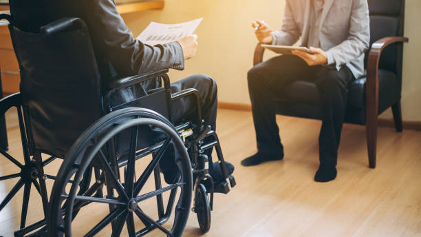 Man on wheelchair with his boss. After car accident and rehabilitation, a businessman can return to work again. The company which employing disable people will receive tax deductions benefits. again stock pictures, royalty-free photos & images