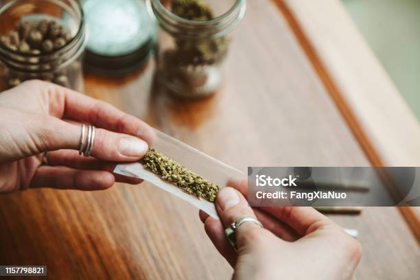 Hands Making Cannabis Joint At Marijuana Shop Stock Photo - Download Image Now - Cannabis Plant, Cannabis - Narcotic, Marijuana - Herbal Cannabis