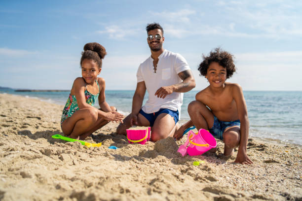 istock Enjoying summer vacation on the beach 1157800223